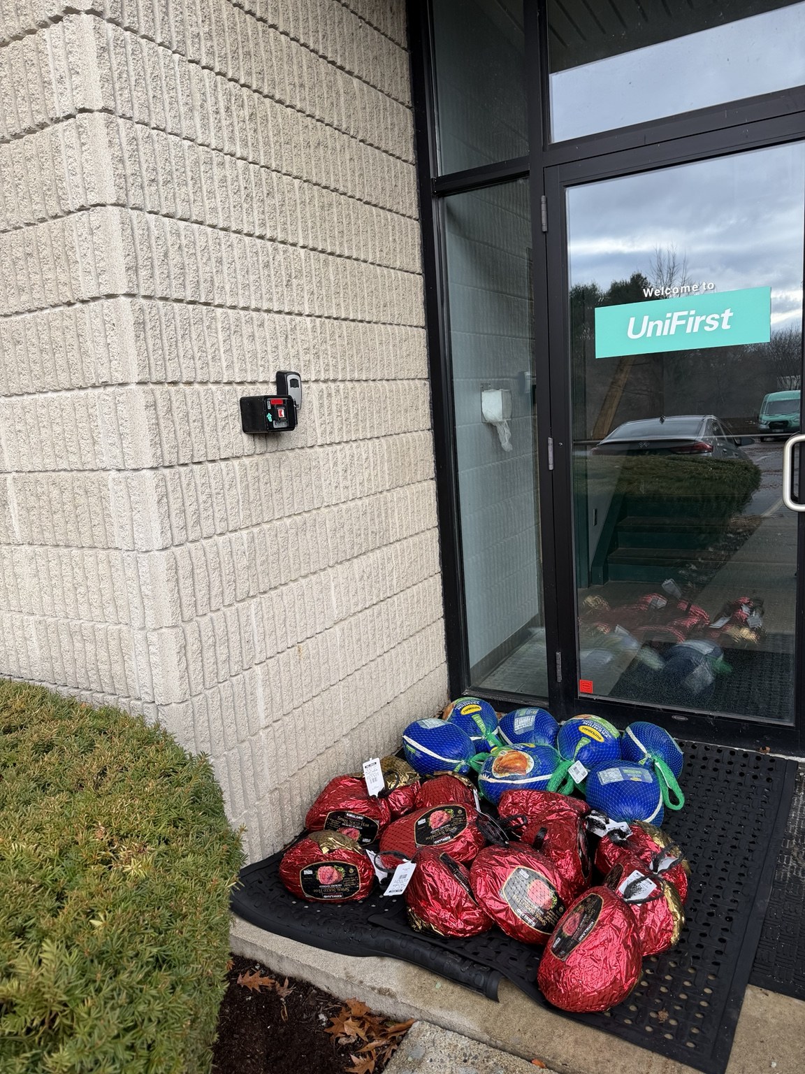 Sean Bennett giving holiday food items to staff