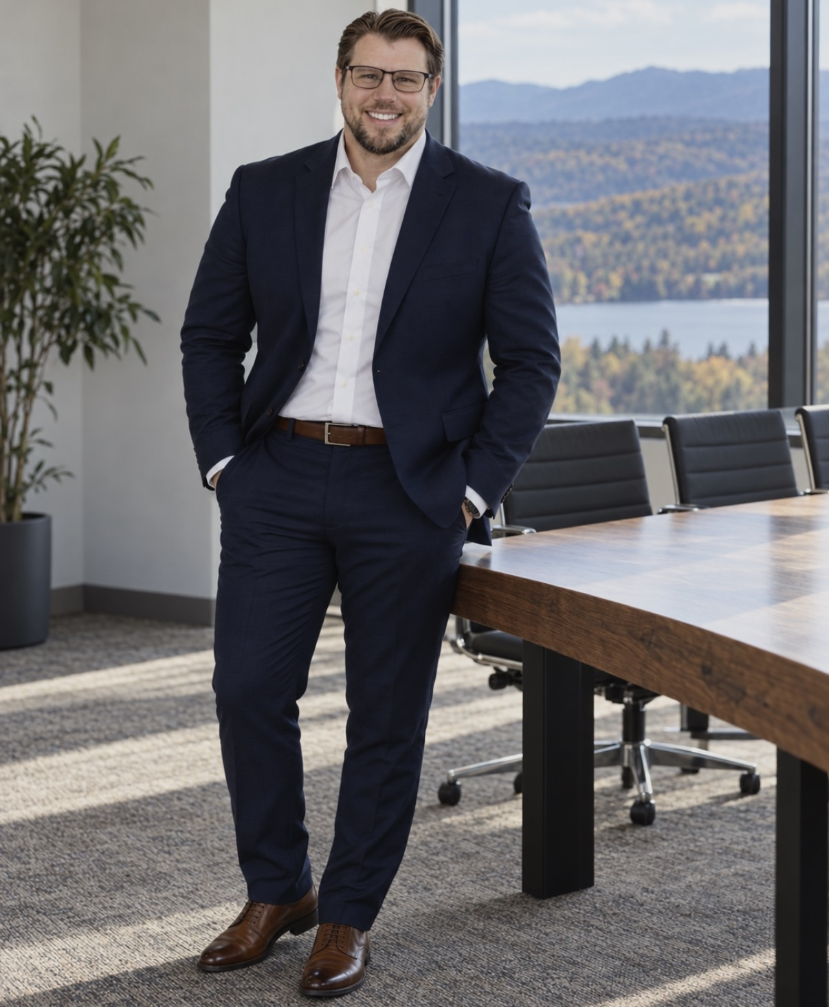 Sean Bennett in a navy suit in a professional office setting